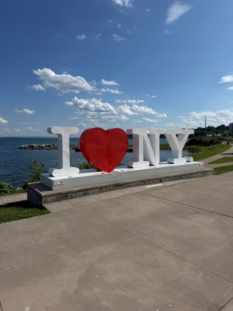 An I Love New York sign on the edge of Seneca Lake.